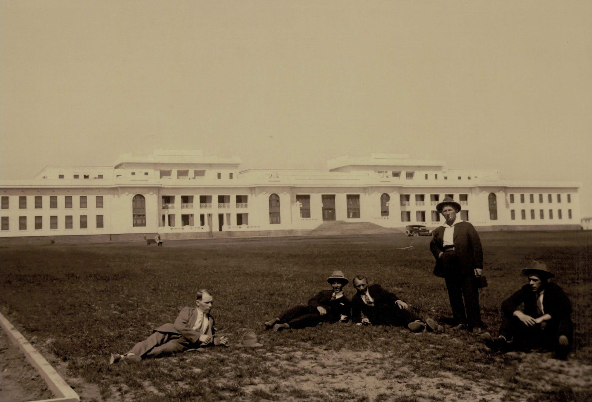 Estonian men relaxing on the grounds in front of the Temporary Parliament House when they were employed in the building of the infrastructure for Australia’s new Federal Capital, called Canberra just few weeks after their arrival in Australia.
